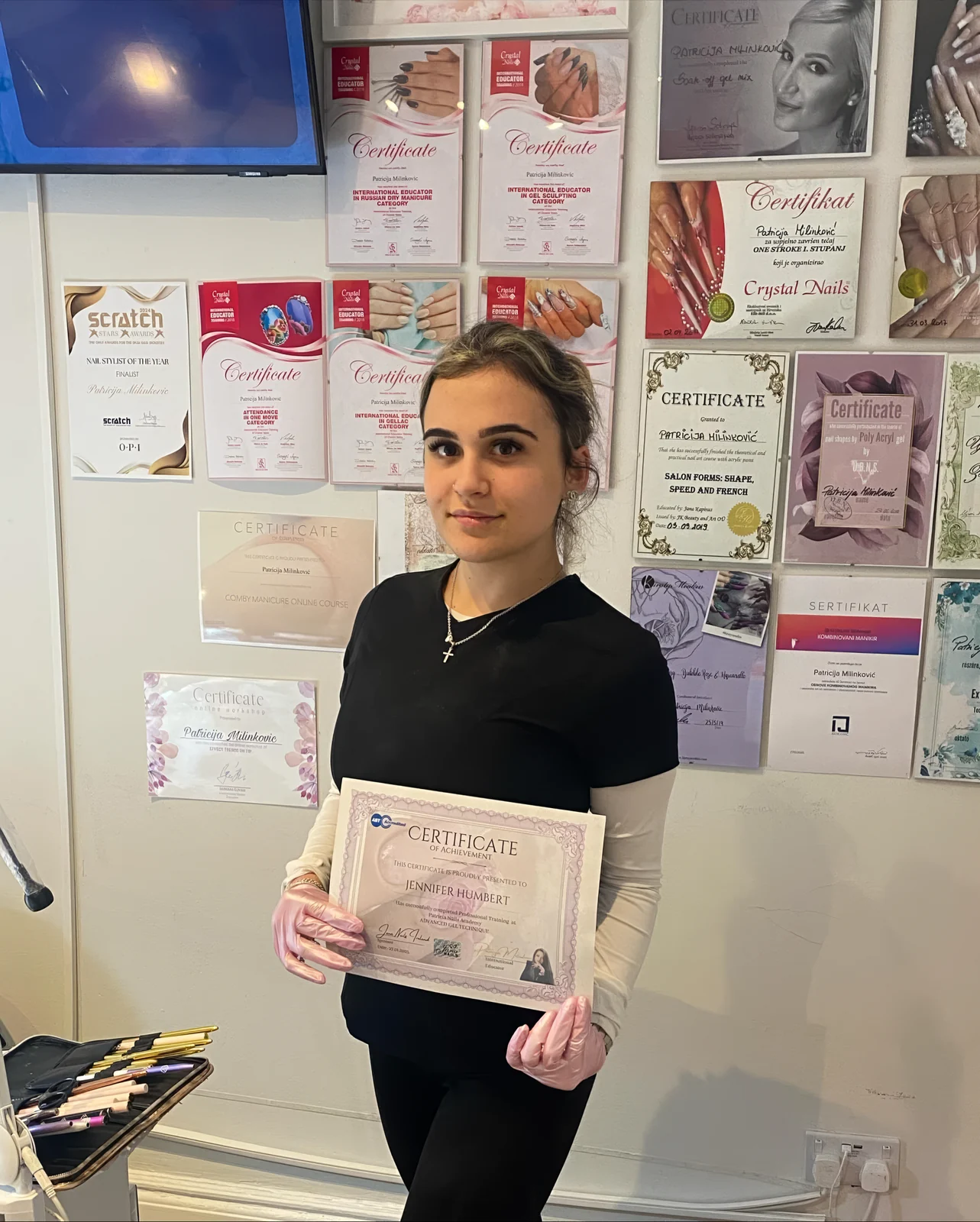 Jenny holding her Advanced Gel Technique certificate at Patricija Nails Academy